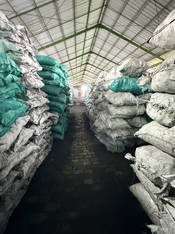 Bagged charcoal pallets in storage